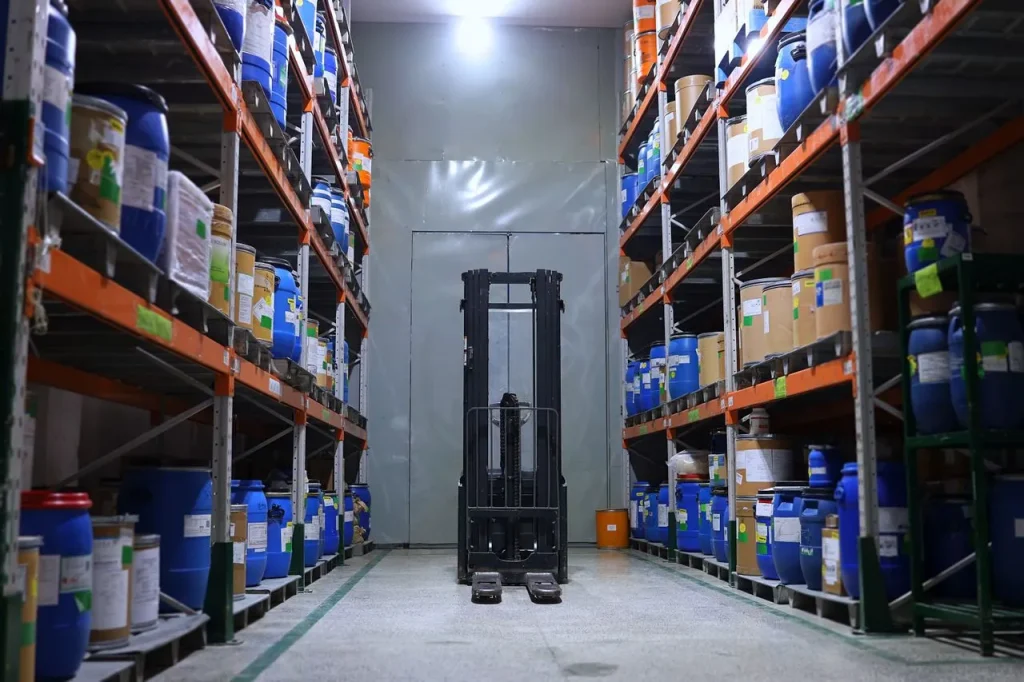 Industrial warehouse of a construction chemicals supplier in Malaysia with storage racks and a forklift
