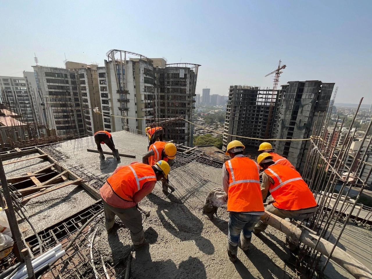 Workers at a construction site in Malaysia where construction chemicals support concreting and building works
